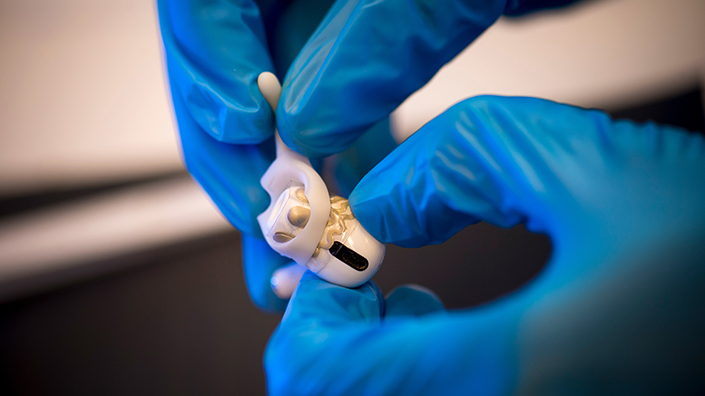 The earbuds are secured with a silicon hook in order to be more stable in the ear. @ University of California, San Diego