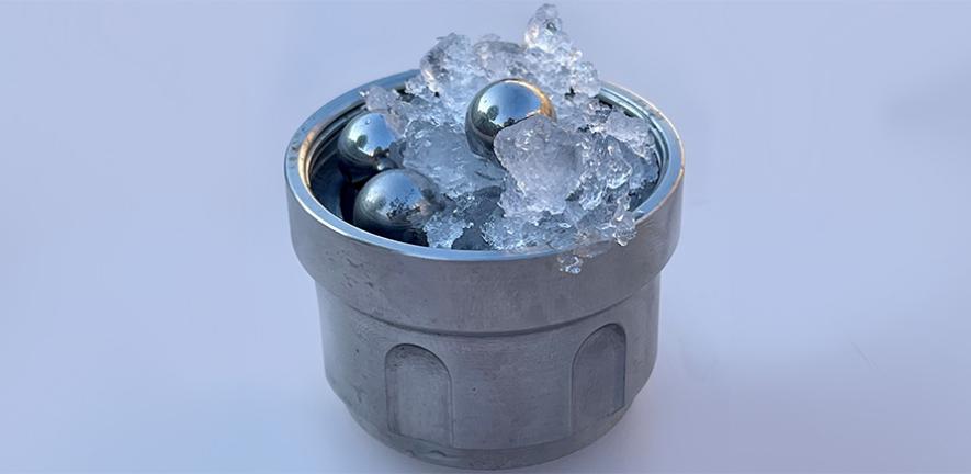 Part of the set-up for creating medium-density amorphous ice: ordinary ice and steel balls in a jar (not amorphous ice). @ Christoph Salzmann