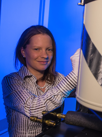 Rice University scientist Emilie Ringe, working at Rice’s electron microscopy center, led a new study to establish that plasmonic nanoparticles can support catalysts without losing their beneficial optical properties. Photo by Jeff Fitlow