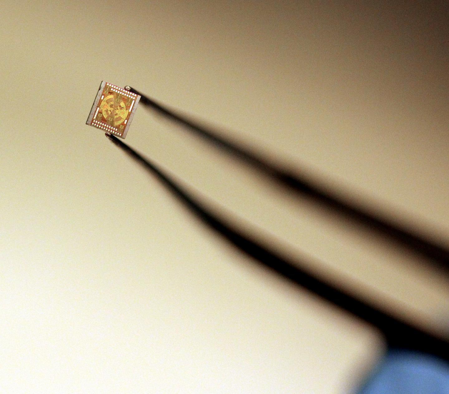 Princeton University researchers have drastically shrunk the equipment for producing terahertz -- important electromagnetic pulses lasting one millionth of a millionth of a second -- from a tabletop setup with lasers and mirrors to a pair of microchips small enough to fit on a fingertip (above). The simpler, cheaper generation of terahertz has potential for advances in medical imaging, communications and drug development. @ (Photos by Frank Wojciechowski for the Office of Engineering Communications)