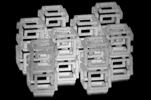 MIT engineers have devised a way to create 3-D nanoscale objects by patterning a larger structure with a laser and then shrinking it. This image shows a complex structure prior to shrinking. @ Daniel Oran