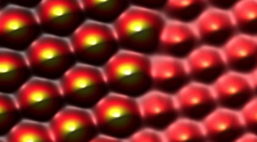 Atomically-resolved image of two noble gas monolayers – xenon on the left, argon on the right – adsorbed to a copper surface. Measured using frequency-modulation AFM. @ Ferdinand Huber (University of Regensburg)
