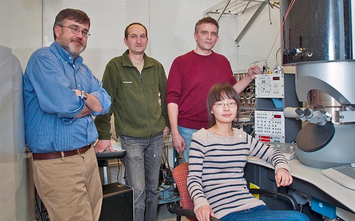 Collaborating scientists (left to right) Eric Stach, Dmitri Zakharov, Anatoly Frenkel, and Yuanyuan Li at a transmission electron microscope (TEM) in the Center for Functional Nanomaterials.