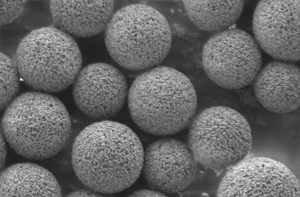 A highly magnified portion of a "puck" studded with 10-micrometer beads in a single layer. Courtesy of the Macosko and Chen labs.