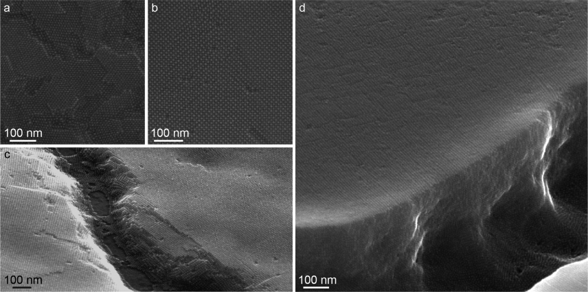 These images show scanning electron micrographs of the researchers' sample quantum dot films. The dark spots are the individual quantum dots, each about 5 nanometers in diameter. Images a and b show the consistent size and alignment of the quantum dots at the surface. The exposed edges in images c and d show depth and long-range ordering of the nanocrystals. Image courtesy of the researchers