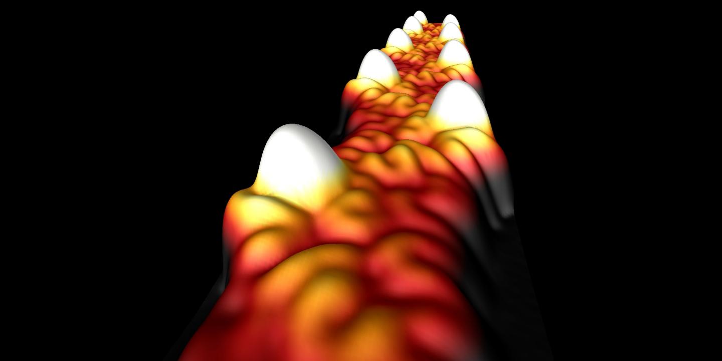 Scanning tunneling microscope image of narrow-band metallic graphene nanoribbon (GNR). The white protrusions correspond to singly-occupied electron orbitals that have been carefully arranged to form extended conducting states. Here the GNR backbone has a width just 1.6 nanometers. @ UC Berkeley image by Daniel Rizzo