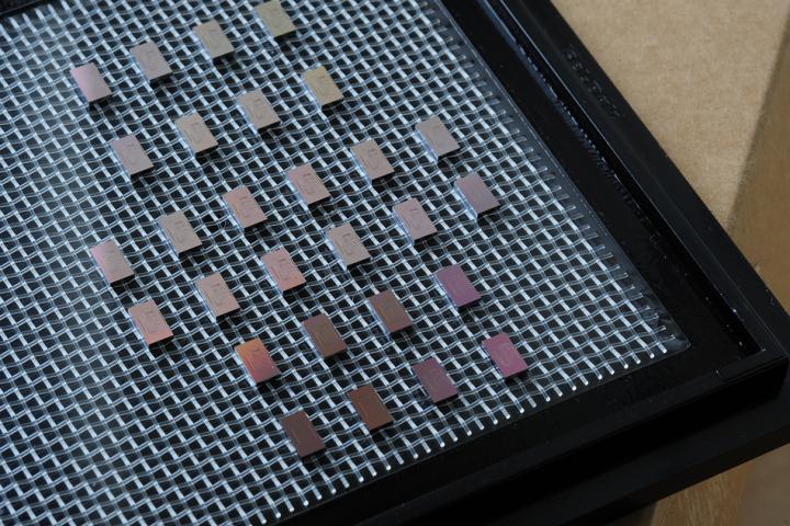 A collection of mini-spectrometer chips are arrayed on a tray after being made through conventional chip-making processes. @ Felice Frankel