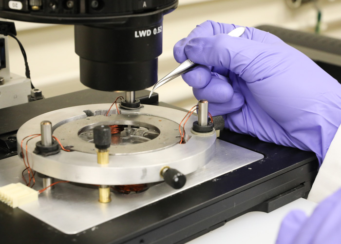 The U of T Engineering researchers' system uses six magnetic coils (pictured) to control the position of a microscopic iron bead within the device. The bead is small enough to enter human cells and can be positioned with unprecedented accuracy. @ Tyler Irving / U of T Engineering News