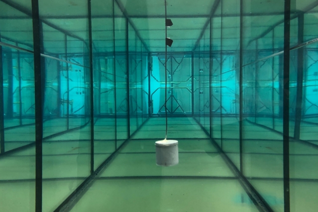 A battery-free underwater “piezoelectric” sensor invented by MIT researchers transmits data by absorbing or reflecting sound waves back to a receiver, where a reflected wave decodes a 1 bit and an absorbed wave decodes a 0 bit — and simultaneously stores energy. @ MIT researchers