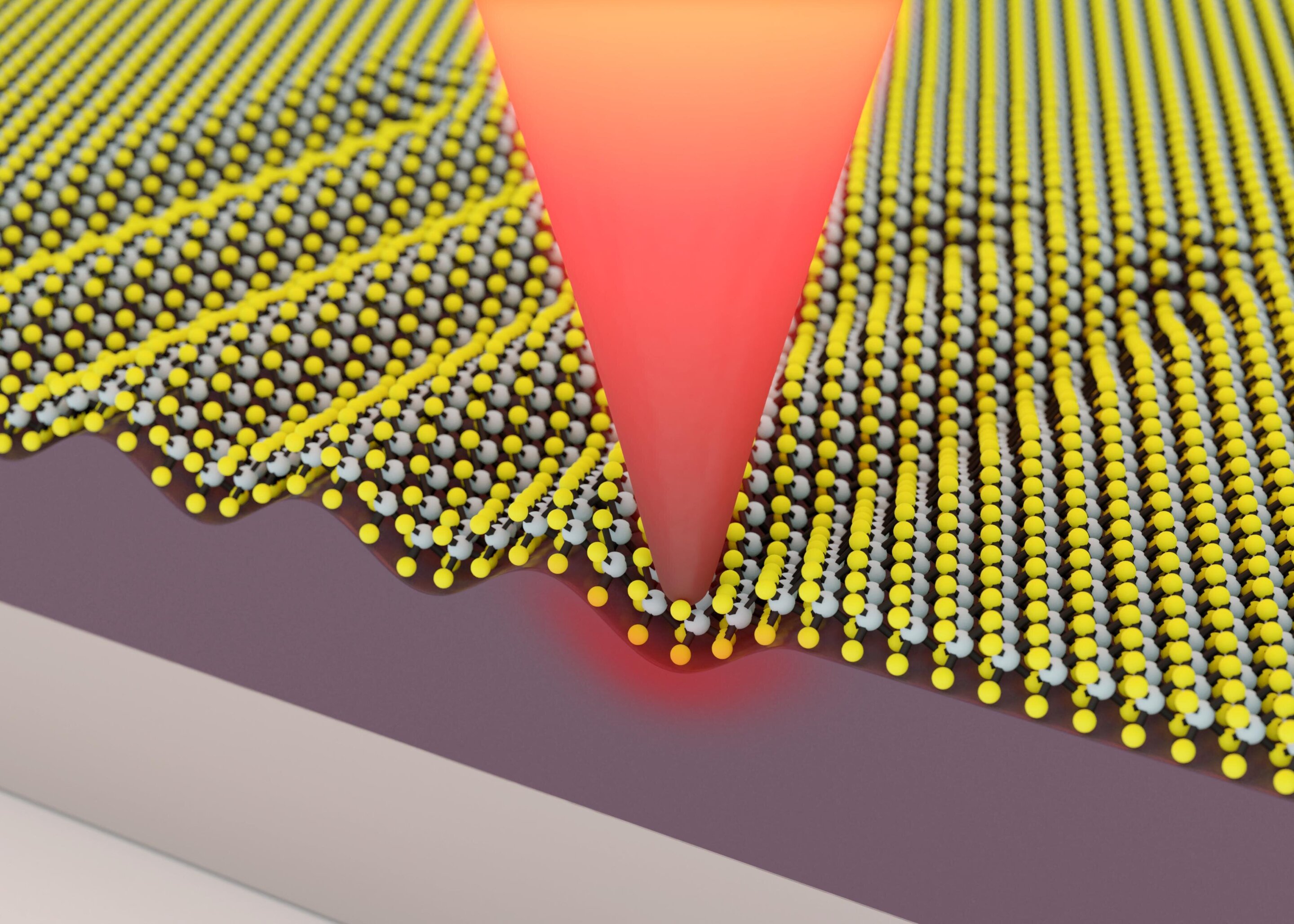 A heated nanometric tip deforms the material to changes its properties.